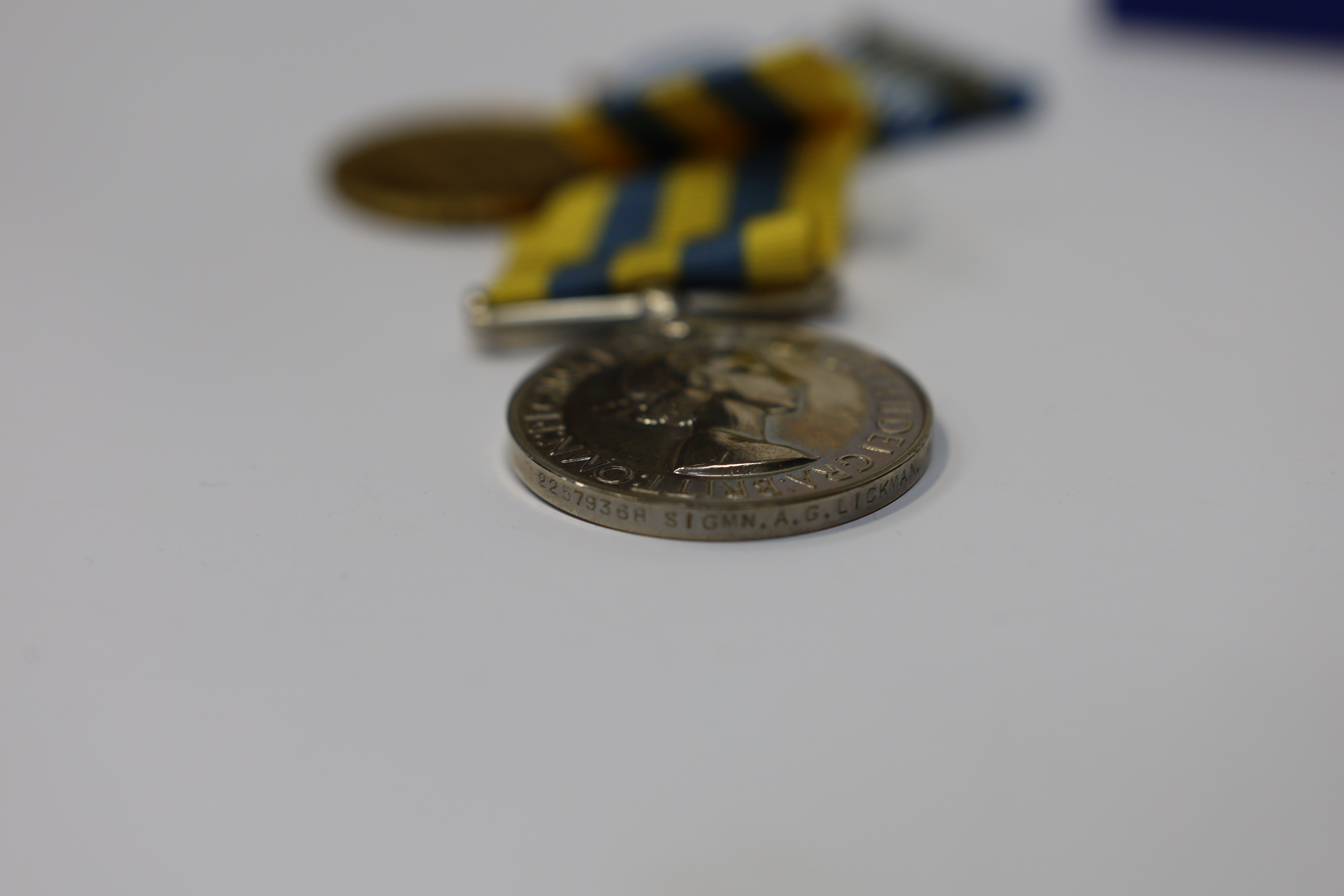 An ERII Operational Service Medal for Afghanistan awarded to Sgt. A.J. Pugsley RAMC (R), together with a Korea medal pair awarded to Sigmn. A.G. Lickman R.Sigs., all in separate issue boxes. Condition - fair to good